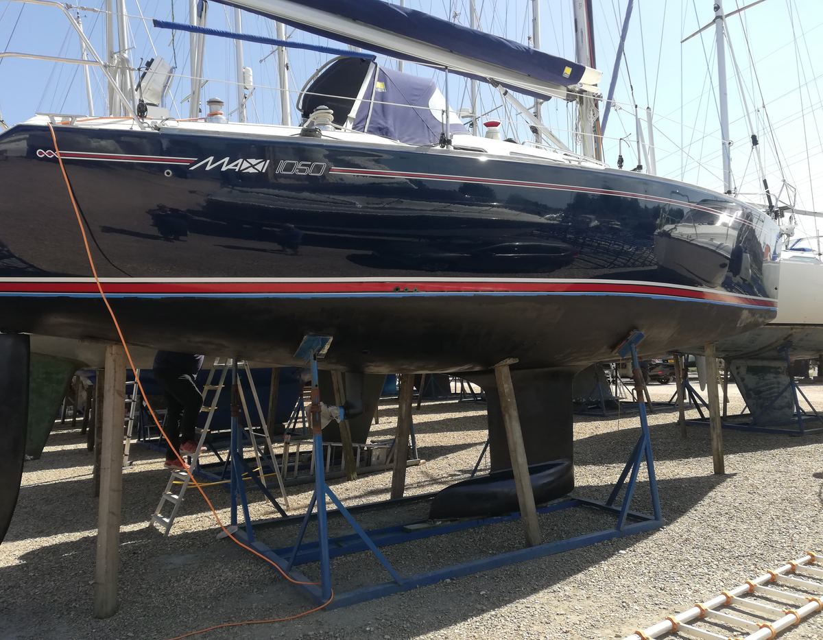 Professional boat polish reflecting surroundings